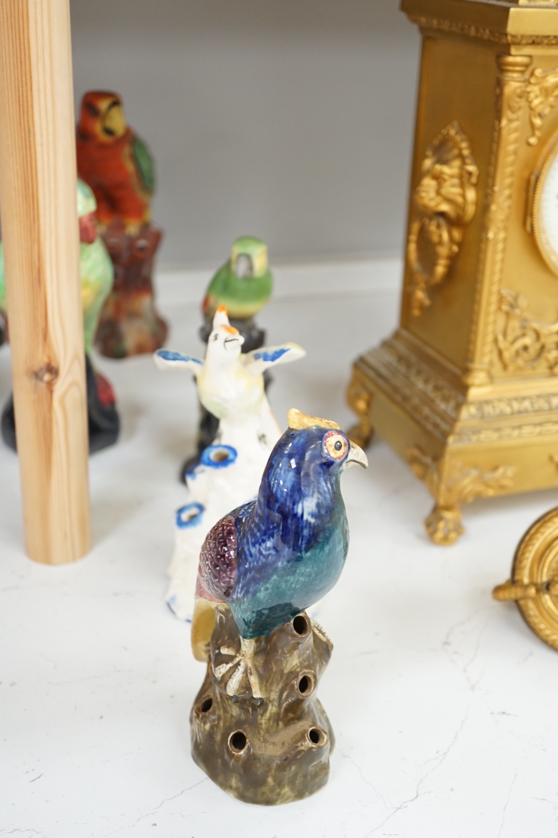 A group of twelve ceramic parrots including one by S Hancock & Sons, largest 24cm high